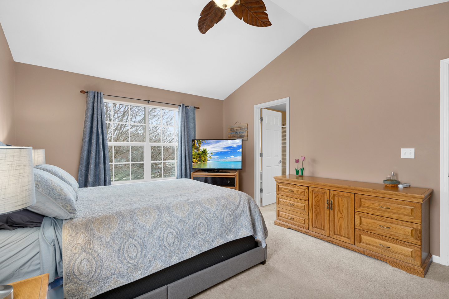 751 Sumac Drive Aurora, IL 60506 - Photo 20 of 33 a bedroom with a bed and furniture with a flat tv screen