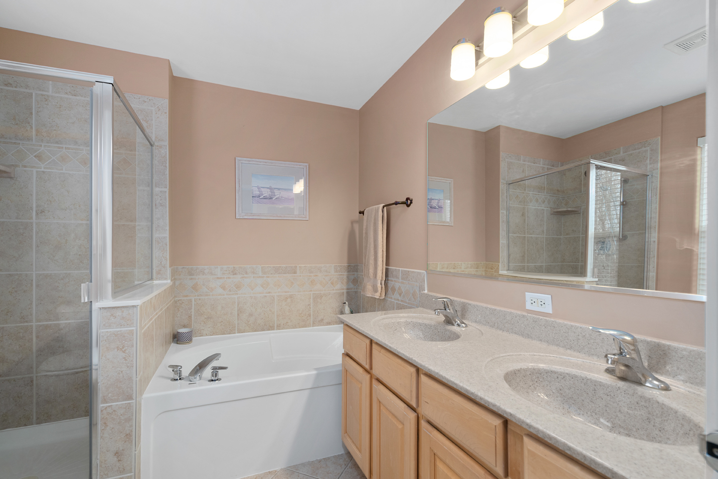 751 Sumac Drive Aurora, IL 60506 - Photo 21 of 33 a bathroom with a granite countertop sink a large mirror and shower