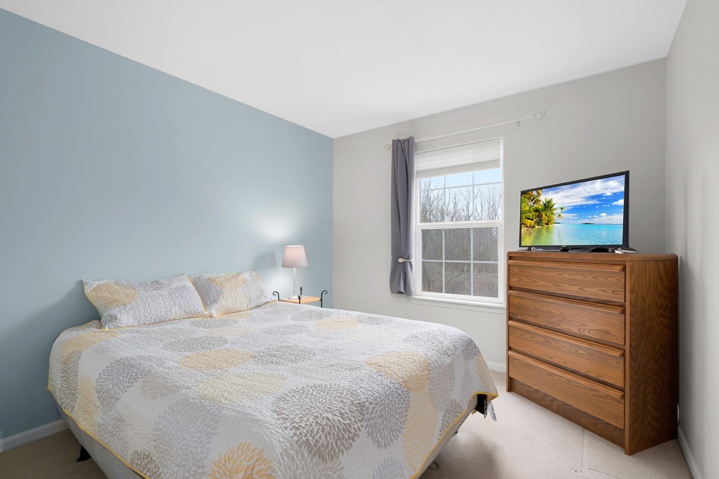 751 Sumac Drive Aurora, IL 60506 - Photo 24 of 33 a bedroom with a bed and a flat screen tv