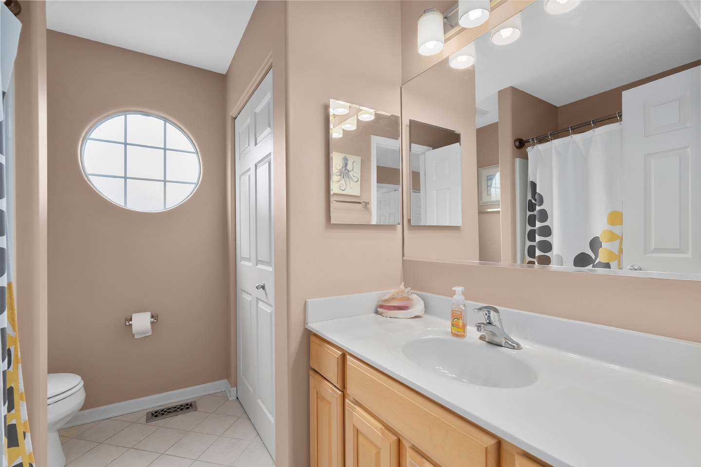 751 Sumac Drive Aurora, IL 60506 - Photo 25 of 33 a bathroom with a sink a toilet and a mirror