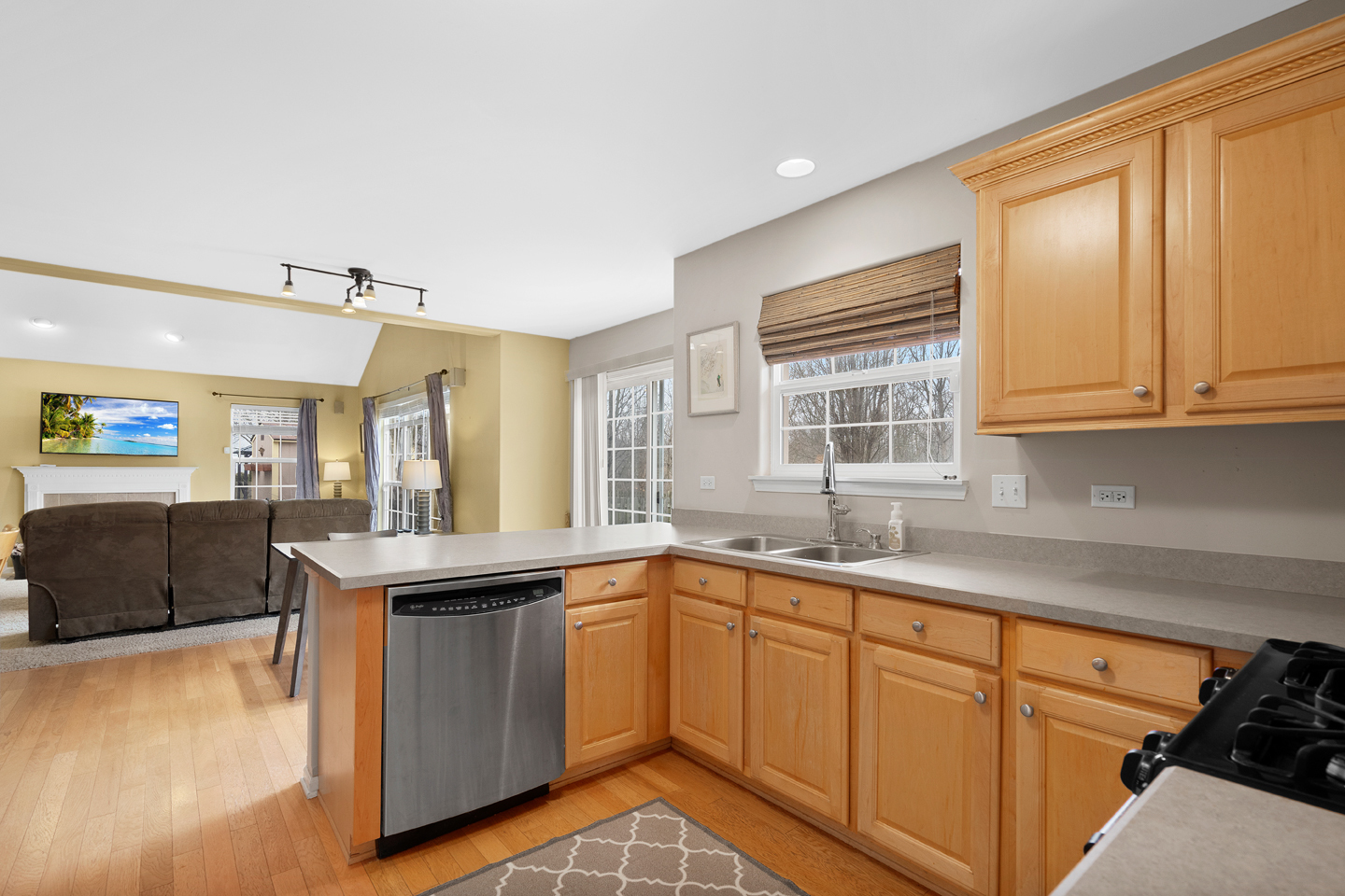 751 Sumac Drive Aurora, IL 60506 - Photo 10 of 33 a kitchen with a sink stove and cabinets