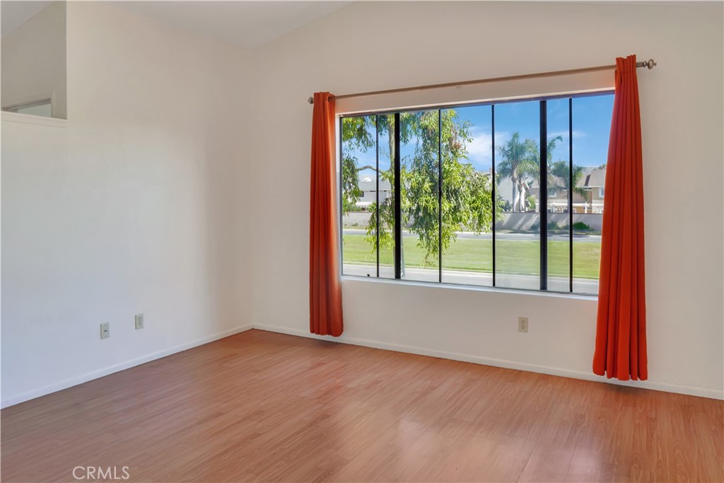 26 Appomattox Irvine, CA 92620 - Photo 7 of 19 a view of an empty room with wooden floor and a window