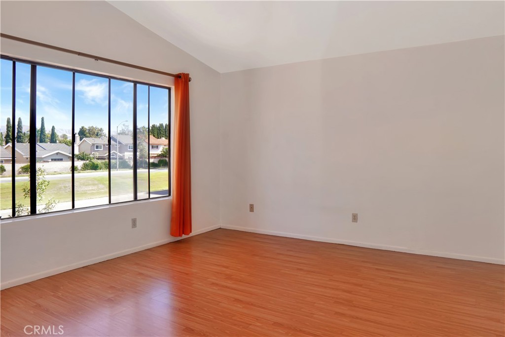 26 Appomattox Irvine, CA 92620 - Photo 8 of 19 a view of an empty room with wooden floor and a window