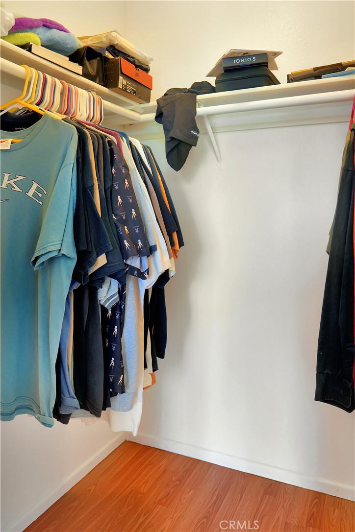 26 Appomattox Irvine, CA 92620 - Photo 10 of 19 a view of walk in closet with clothes and shoes