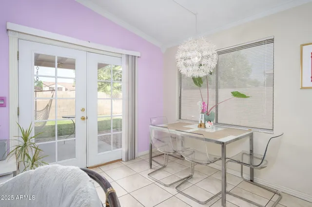 a view of a dining room with furniture and a window