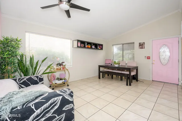 a bedroom with furniture and a chair