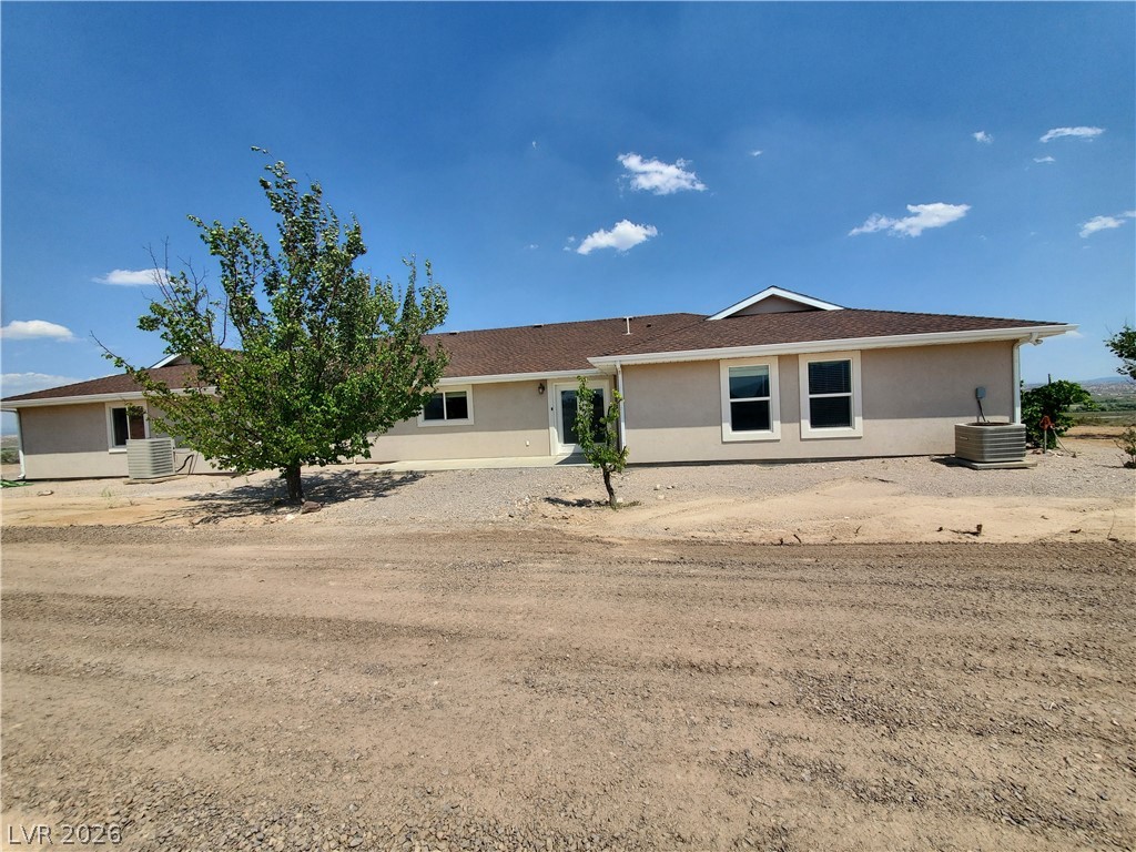 5272 Truman Lane Caliente, NV 89008 - Photo 32 of 43 Rear view of property featuring stucco siding