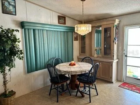 a dining room with a table and chairs