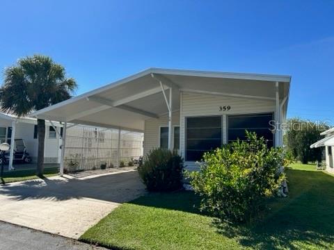 359 Pine Loop Frostproof, FL 33843 - Photo 2 of 31 a front view of a house with garden