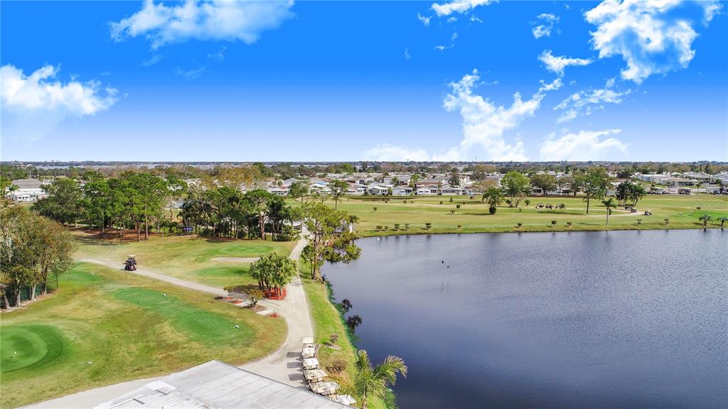 359 Pine Loop Frostproof, FL 33843 - Photo 22 of 31 a view of a lake with a large trees