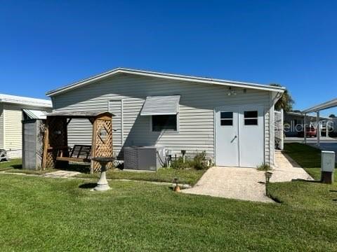 359 Pine Loop Frostproof, FL 33843 - Photo 3 of 31 a front view of a house with a yard