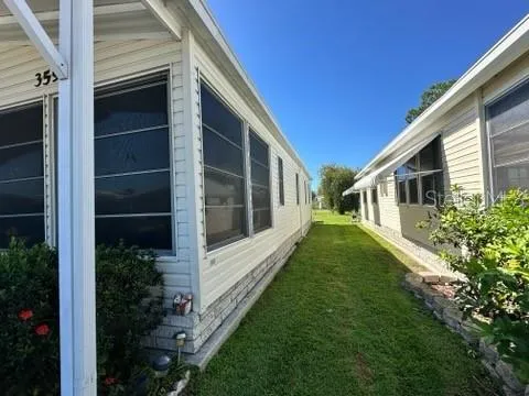 a view of house with backyard and garden