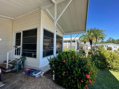 359 Pine Loop Frostproof, FL 33843 - Photo 6 of 31 a view of a house with backyard and sitting area