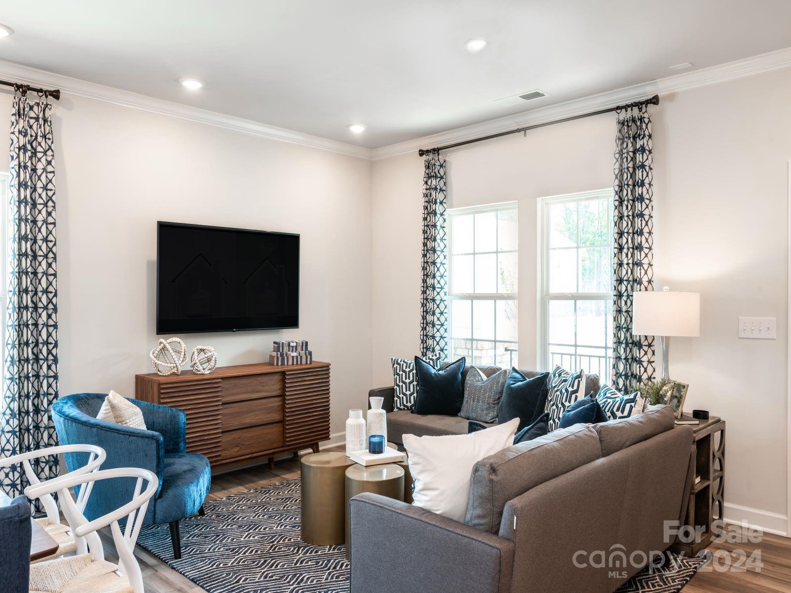 636 Cranford Drive Pineville, NC 28134 - Photo 5 of 18 a living room with furniture and a flat screen tv