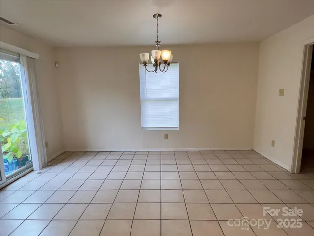 a kitchen with stainless steel appliances granite countertop a stove sink and cabinets