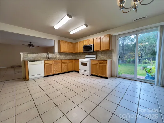 a view of storage and utility room with racks on the wall