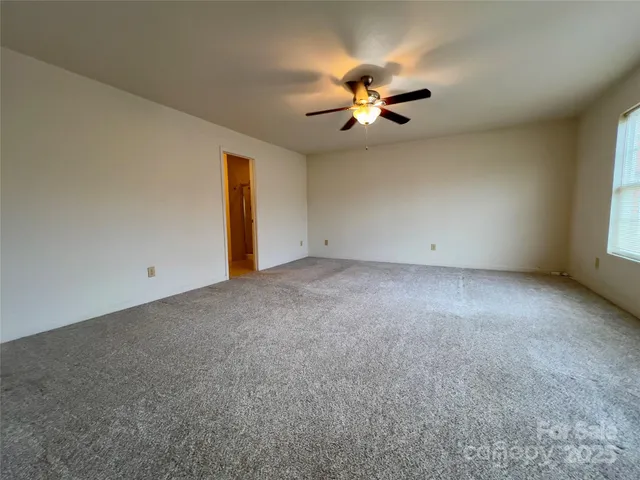 a view of empty room with windows