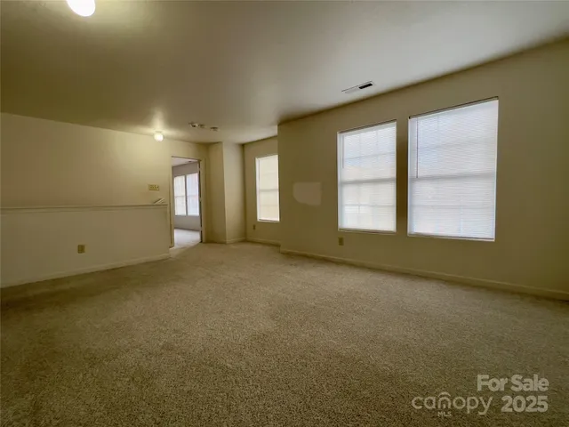 a bathroom with a sink and mirror with bathtub