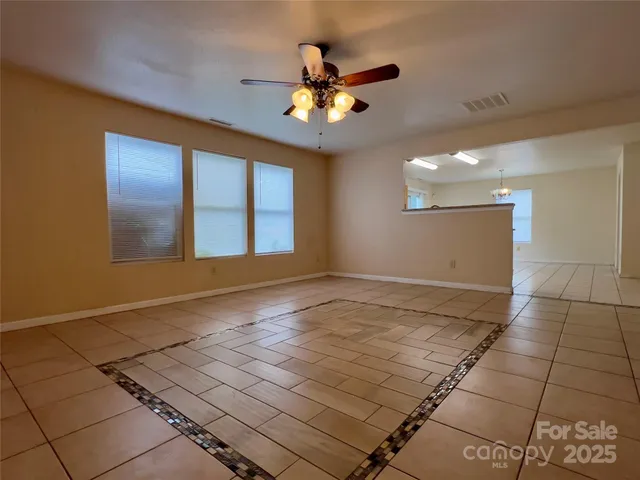 a kitchen with stainless steel appliances a stove a sink and a refrigerator