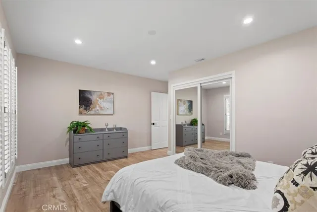 a bedroom with a bed and a cabinets