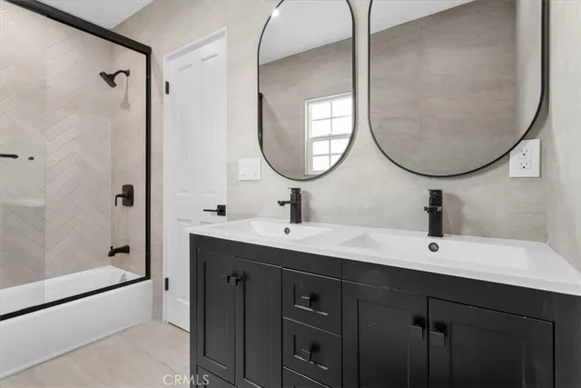 a bathroom with a toilet a sink and a mirror