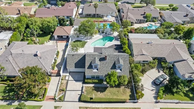 an aerial view of a house with a garden and plants