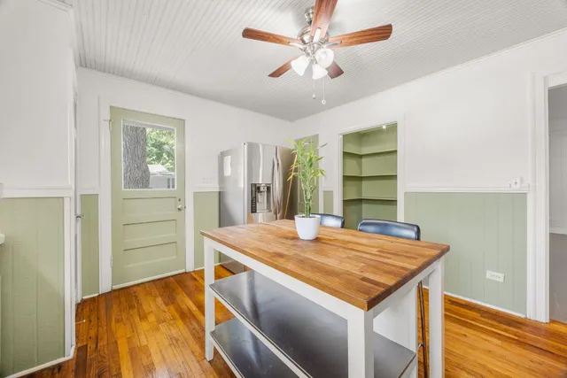 a view of a kitchen with a stove and a refrigerator