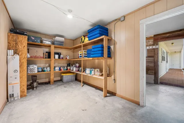 a view of room with window and furniture