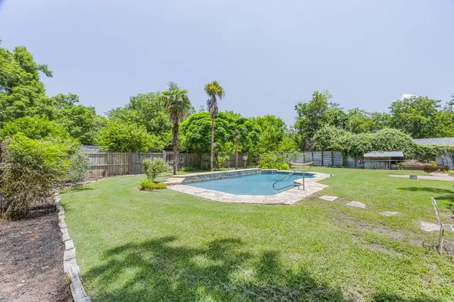 a view of a golf course with a house