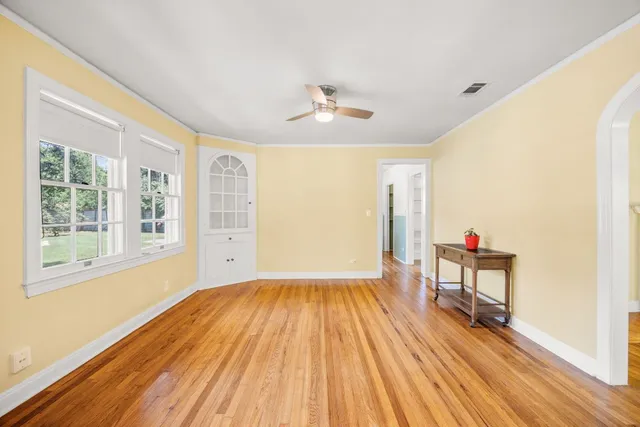 a view of livingroom with furniture wooden floor and windows