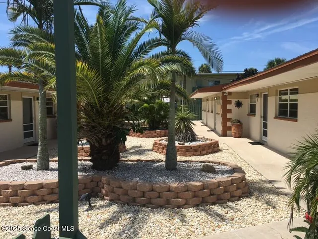 a view of a house with backyard of the house