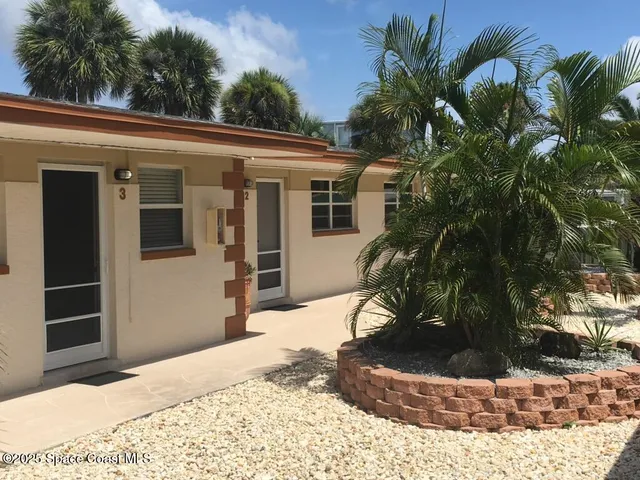 a view of a house with a small yard