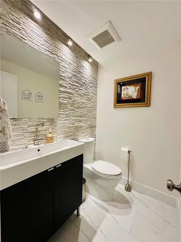a bathroom with a sink a shower and a mirror