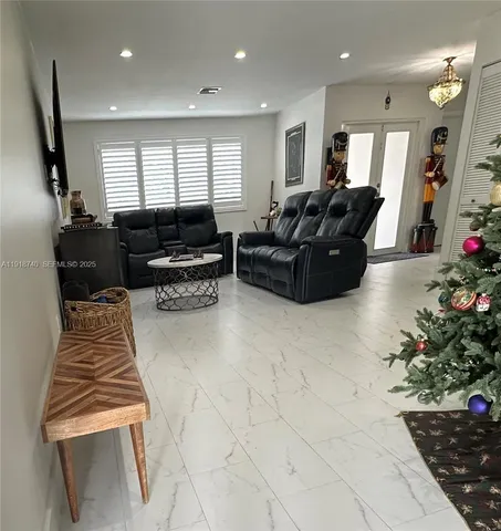 a kitchen with a sink cabinets and window