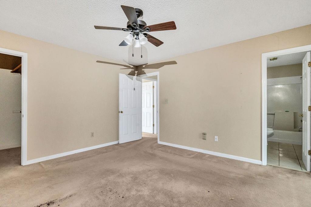 5800 Yellow Creek Road Murrayville, GA 30564 - Photo 14 of 33 an empty room and a chandelier fan