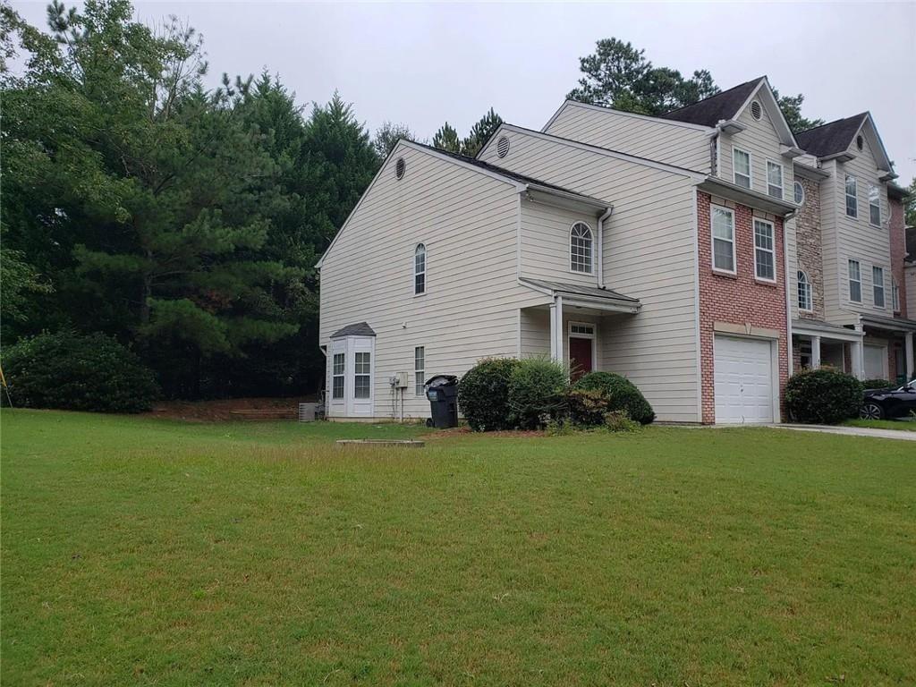 6071 Grovegate Lane Tucker, GA 30084 - Photo 1 of 1 a view of a house with backyard and garden