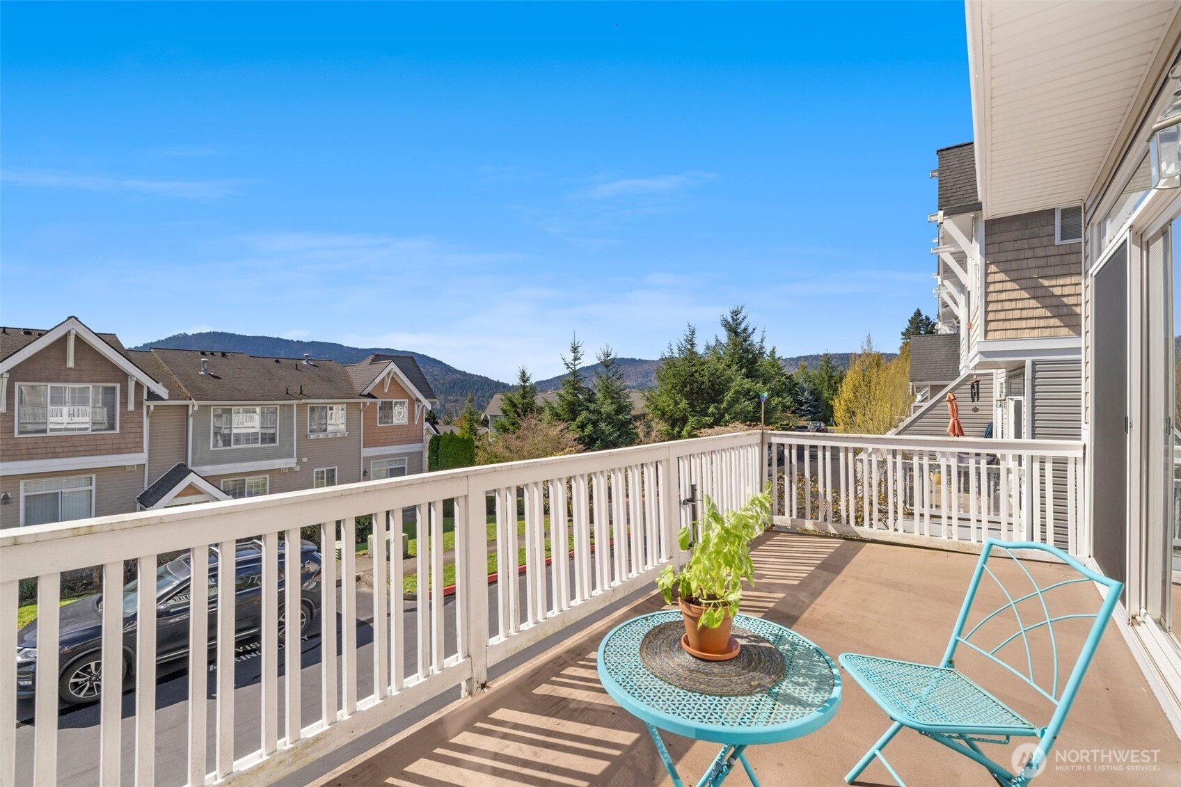 23120 Southeast Black Nugget Road, Unit E1 Issaquah, WA 98029 - Photo 31 of 39 a view of a chair and table on the roof deck