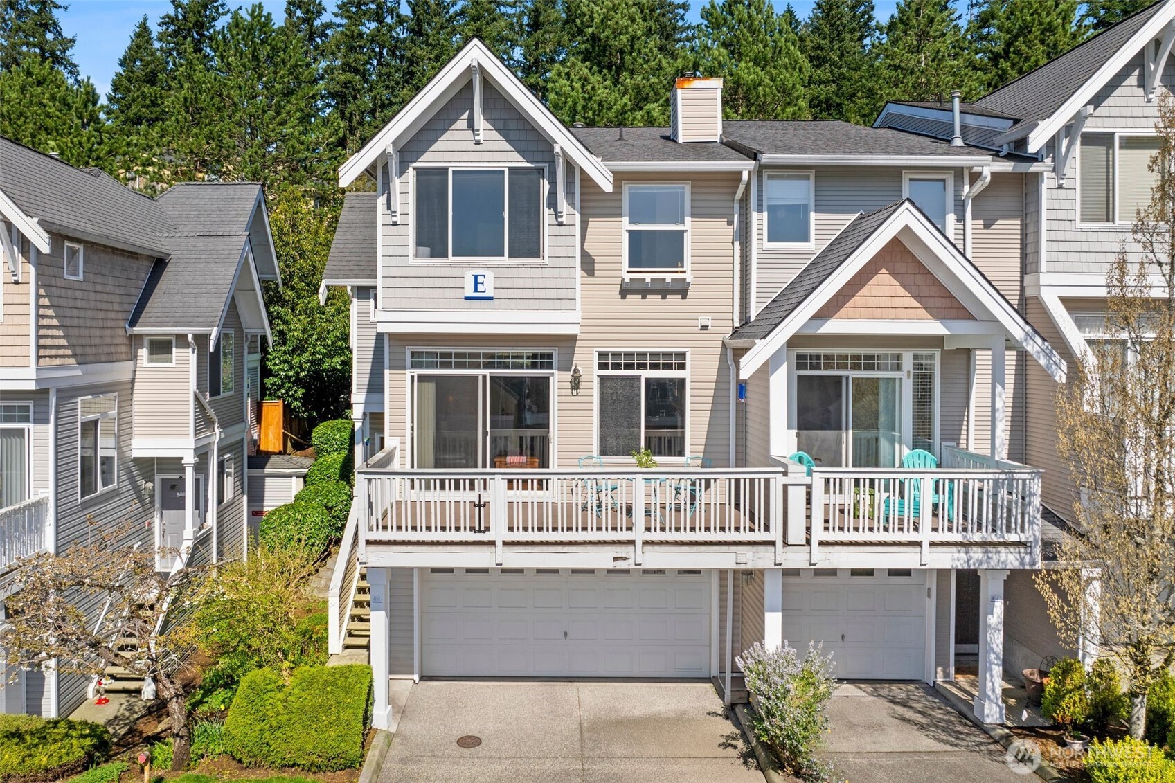 23120 Southeast Black Nugget Road, Unit E1 Issaquah, WA 98029 - Photo 35 of 39 a front view of a house with a yard