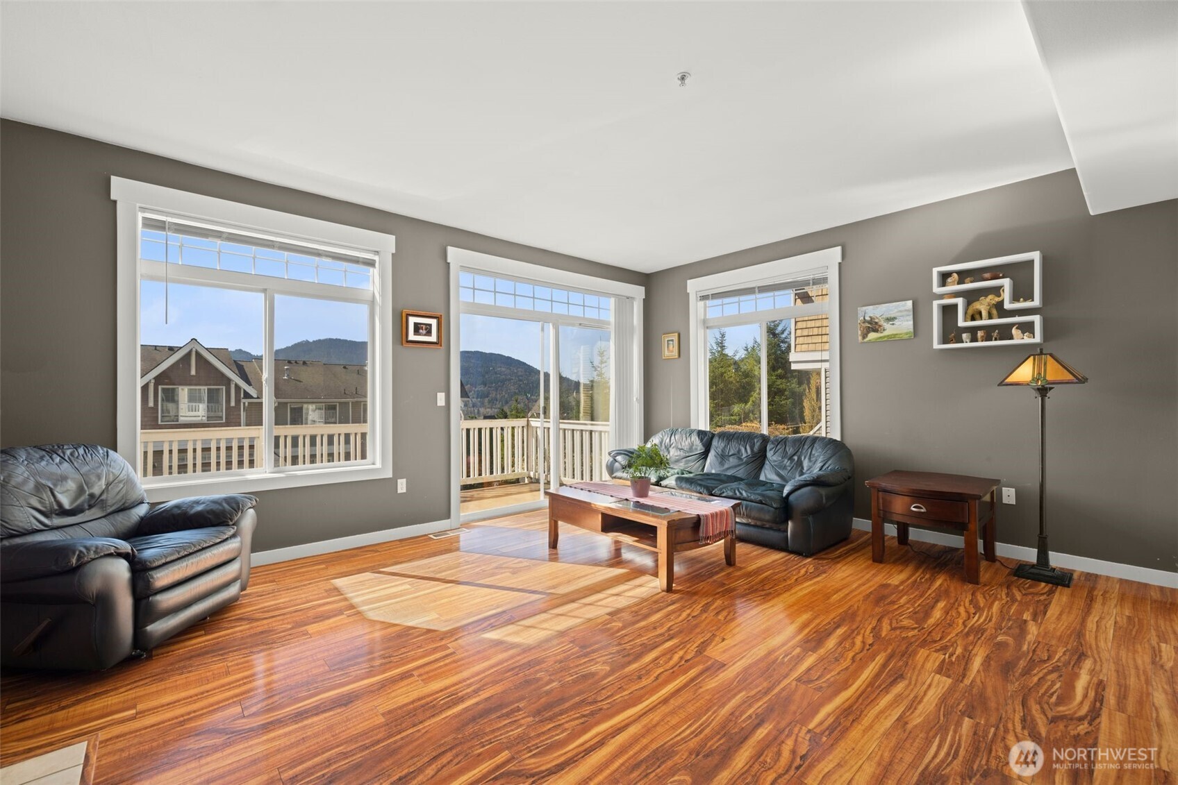 23120 Southeast Black Nugget Road, Unit E1 Issaquah, WA 98029 - Photo 4 of 39 a living room with furniture and large windows