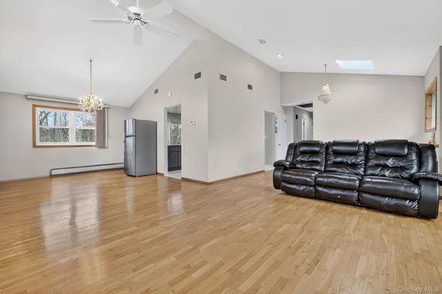 a view of a livingroom with furniture and chandelier