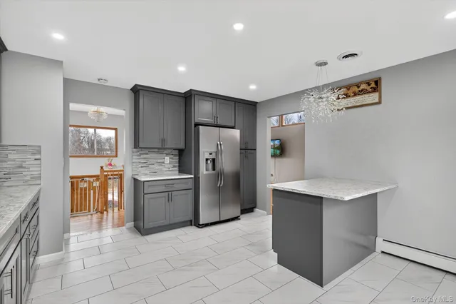 a kitchen with a refrigerator and a sink