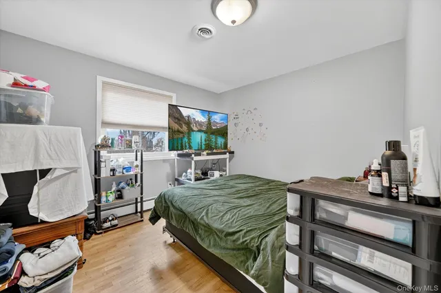 a bedroom with a bed and a window