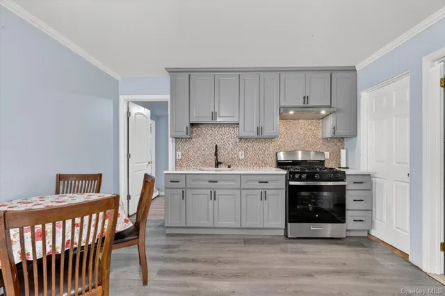 a kitchen with stainless steel appliances a stove a sink dishwasher and a refrigerator