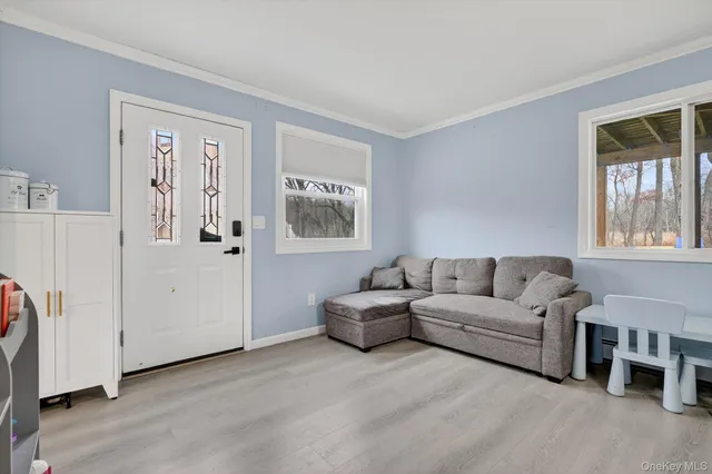 a living room with furniture and a window