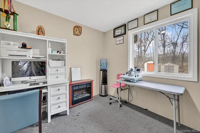 a view of a workspace with furniture