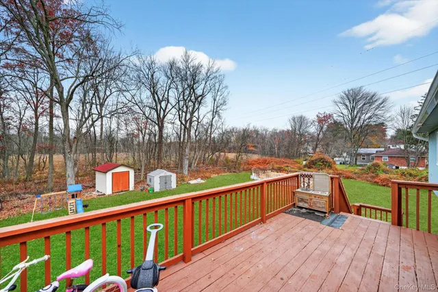 a view of a balcony with wooden fence