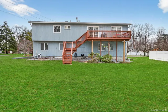 a view of a house with a yard porch and sitting area