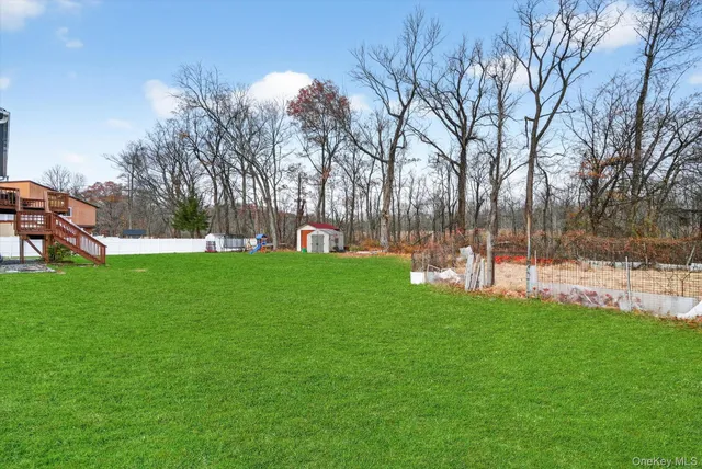 a view of a park with large trees