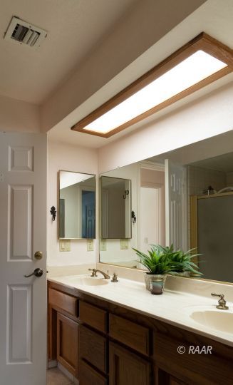 323 West Pilgrim Court Ridgecrest, CA 93555 - Photo 20 of 35 a bathroom with a sink and a mirror