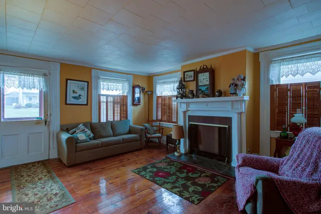 a kitchen with a table chairs sink and cabinets